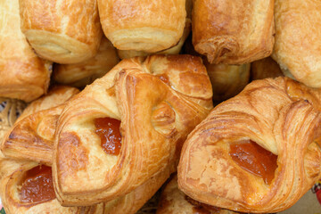 Jam buns. The buns are shaped like an envelope. Puff pastry.