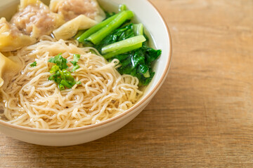 egg noodles with pork wonton soup or pork dumplings soup and vegetable