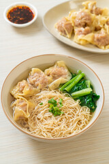 egg noodles with pork wonton soup or pork dumplings soup and vegetable