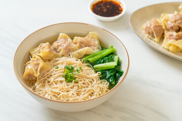 egg noodles with pork wonton soup or pork dumplings soup and vegetable