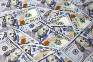 Many one hundred US dollars bills, paper currency for background. Concept of american and global economy, exchange rate