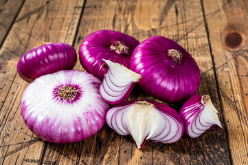 Sweet red onion on a wooden table. Wooden background. Top View