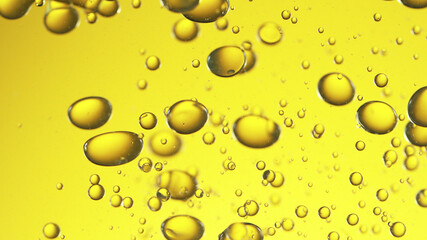 Close up of golden oil bubbles