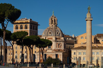 Fototapeta na wymiar Trajan Column, Santa Maria de Loreto church and Chiesa del Santissimo Nome di Maria in Trajan's Forum. Rome, Italy