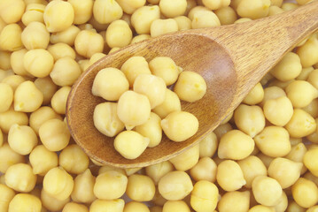 Top view of chick-peas with wooden spoon 
