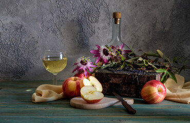 Still life with apples and a glassful of wine close-up