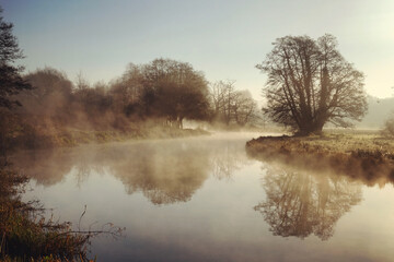 Fototapeta na wymiar Misty morning along the River Wey in Godalming, Surrey, UK