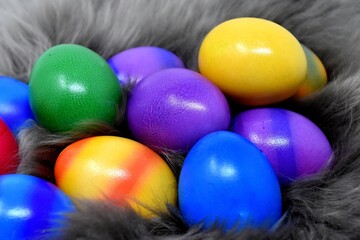 Multi-colored painted eggs for Easter, with and without interior