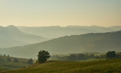 Fototapeta na wymiar Scenic nature and hills at sunrise, Emilia-Romagna, Italy. 