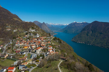 Fototapeta na wymiar Aerial view of Lugano lake and the Monte Brè village in Canton Ticino in southern Switzerland