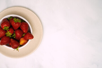 Ripe red strawberries in a bowl
