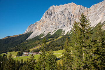 Fototapeta na wymiar upper station of Ehrwalder Almbahn cableway inmidst alpine landscape, Zugspitze mountain