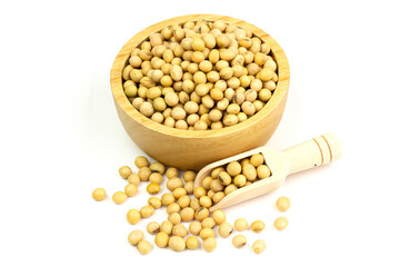 Soybeans in wooden bowl with wooden spoon isolated on white background. Soy contains nutrients that...