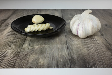 Garlic - a glove, peeled head and chopped