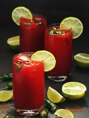 Jalapeno tomato margarita cocktail with lime