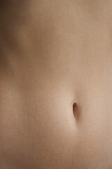 Close up young woman belly. 