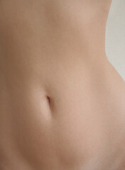 Fototapeta na wymiar Close up young woman belly. 