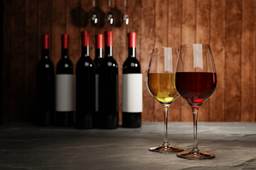 Red and white wine in clear glass, many blurred wine bottle backgrounds Place it on a cement floor with a wooden board wall. The cellar Tasting production concept.3D Rendering