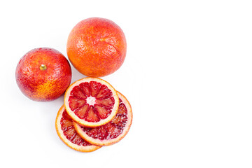 Bloody oranges whole and sliced isolated on white background. Red sicilian orange fruit as package...