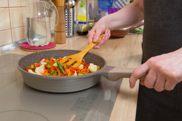 Stewing vegetables on the side dish.