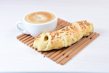 Puff pastry cheese stick, on white wooden background