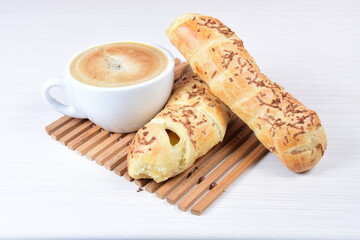 Puff pastry cheese stick, on white wooden background