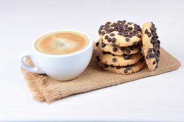 Chocolate chips cookies, on white wooden background