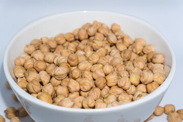 A close up shot of chickpeas in studio settings.Chickpeas, also known as garbanzo beans, are part of the legume family.