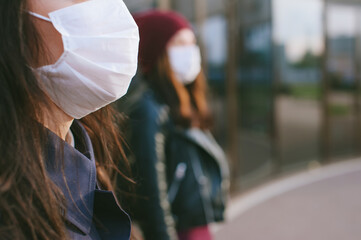Close-up, mask on a girl on the background of a woman.