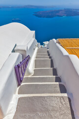 Greece Santorini island in Cyclades, traditional sights of colorful and white washed walk paths like narrow streets and caldera sea in background