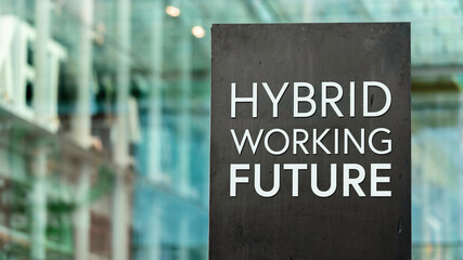 Hybrid Working Future sign in front of a modern office building