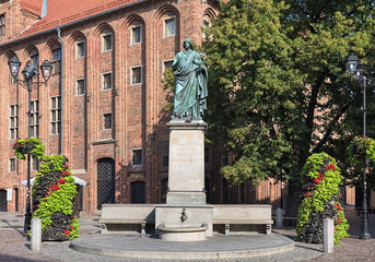 Nicolaus Copernicus Monument in Torun, Poland. The monument was erected in 1853. Latin text on the pedestal reads: Nicolaus Copernicus of Torun, mover of the earth, stopper of the sun and heavens. © Mikhail Markovskiy