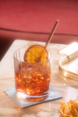 Negroni, an italian IBA cocktail with gin, bitter and vermouth; in luxury elegant home, homemade drink