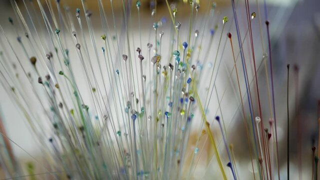 multicolored glass rods, workshop, close-up, no people 4K video
