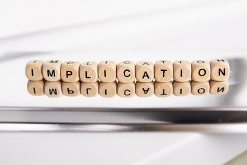 Word implication by wooden cubes