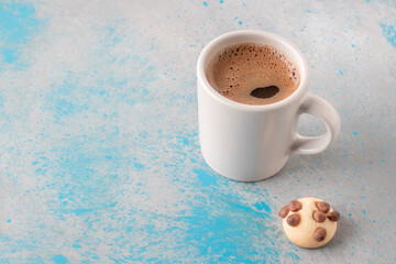 cup of coffee and cookie with chocolate