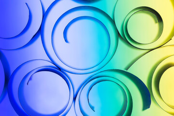 Backlit rolled paper strips on colorful background