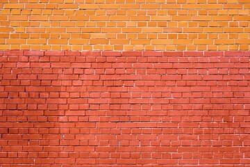 solid texture of an empty brick wall of two shades of red and yellow for background and wallpaper - 426726052