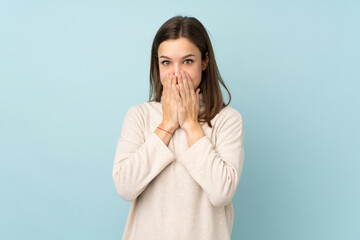 Teenager girl isolated on blue background with surprise facial expression