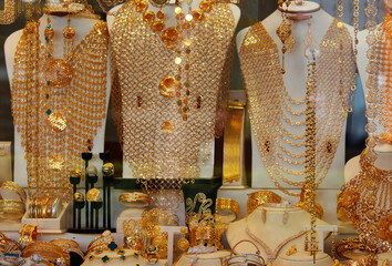 A shop window display filled with arabic gold jewellery In Auburn, Sydney.