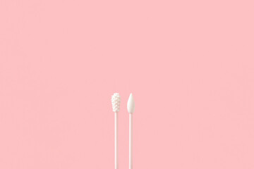 Reusable silicone swab on pink background. Alternative to cotton buds flat lay