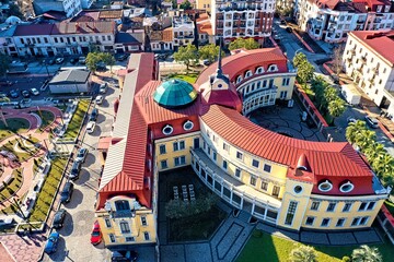 A multi-storey institute with a red roof view from a drone