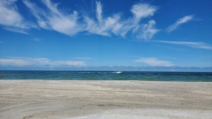 Fototapeta na wymiar Empty beach with blue sky