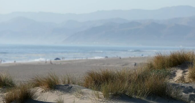 Sunset view of sand dunes along the coast of Oxnard, California, USA.