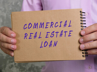  COMMERCIAL REAL ESTATE LOAN sign on the sheet.
