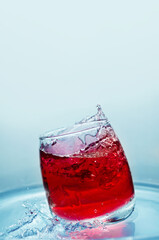 Soft drink with a splash, in the summer heat. Selective focus