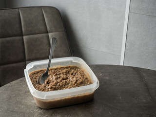 Home office meal waiting - lentils from the day before yesterday, with a spoon