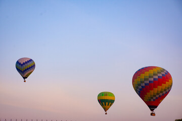 Colorful hot air balloons in morning sky