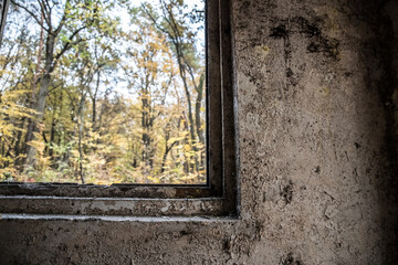 Windows in an old abandoned room with old cracked plaster.