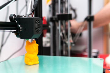 Modern 3D printer printing resin figure. Three-dimensional technology